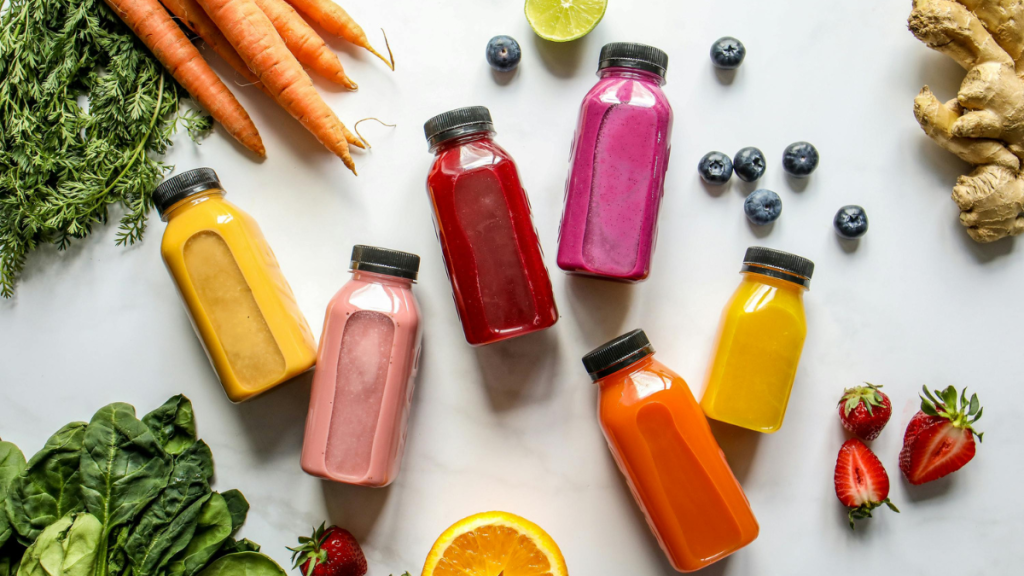 Selection of fresh fruit and vegetable juices in bottles for a 3-day juice cleanse