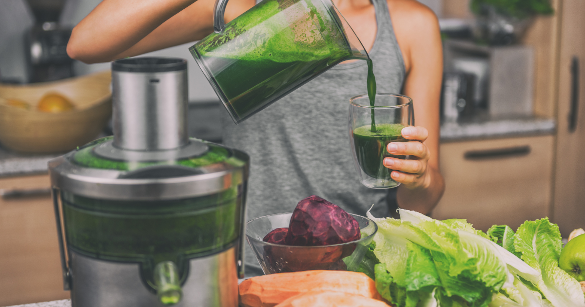 Juice cleanse detox drinks with fresh vegetables and juicer
