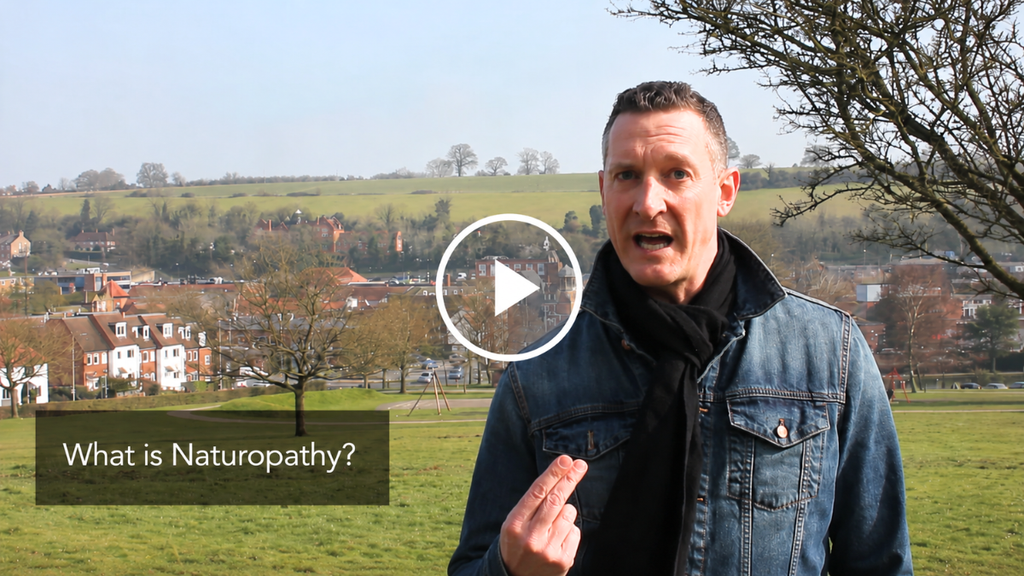 Robert Mazure presenting Nature Cure: The Revival outdoors, with the on-screen question “What is Naturopathy?”